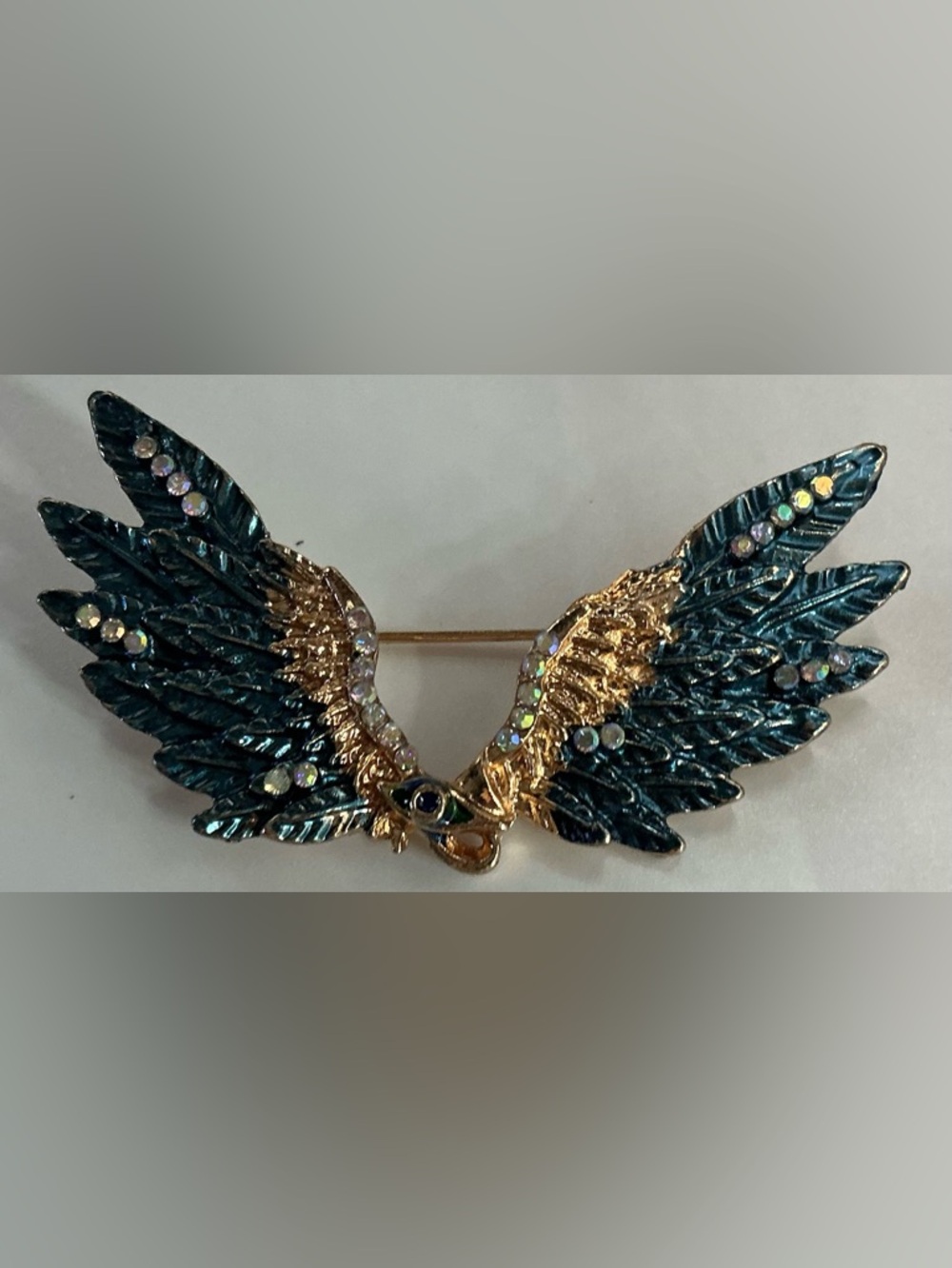 GOLDTONE BLUE ENAMEL WING BROOCH WITH AB RHINESTONE ACCENTS